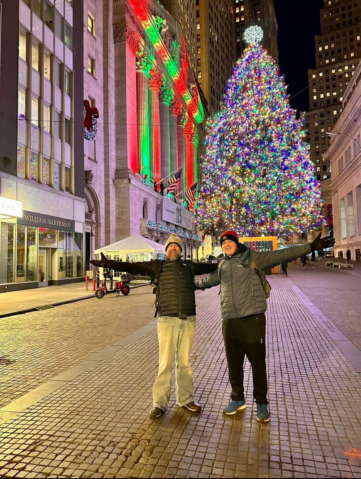Ryan Light standing in front of a Christmas Tree
