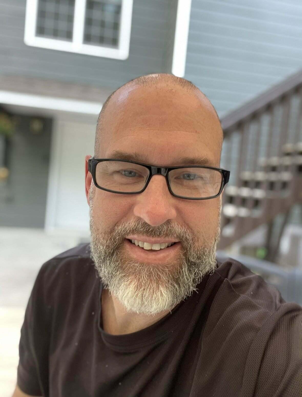 Ryan Light, anxiety coach sitting in the backyard in canton, GA