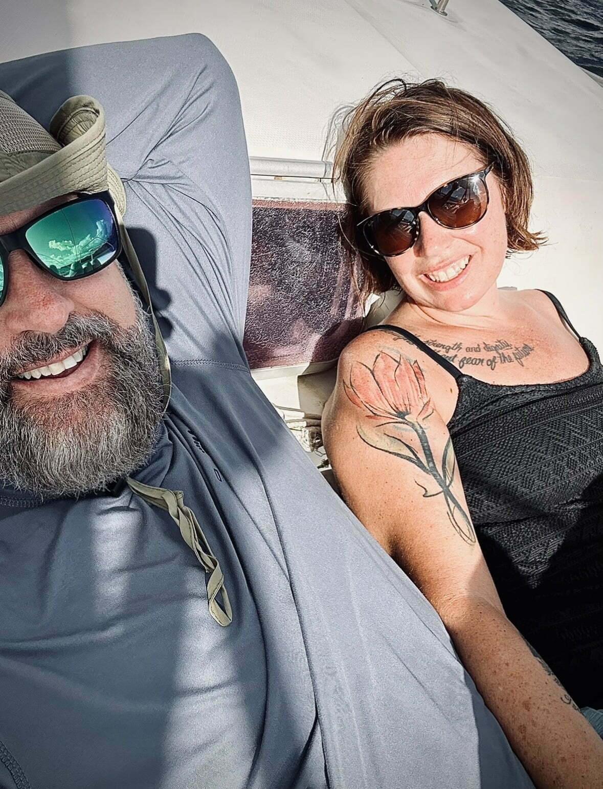 Ryan Light, life coach sitting with his wife, Jessica, in the Caribbean.