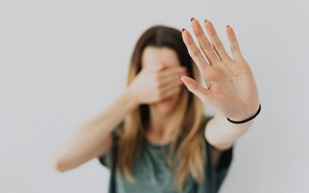 Woman with arm help out showing childhood anxiety patterns